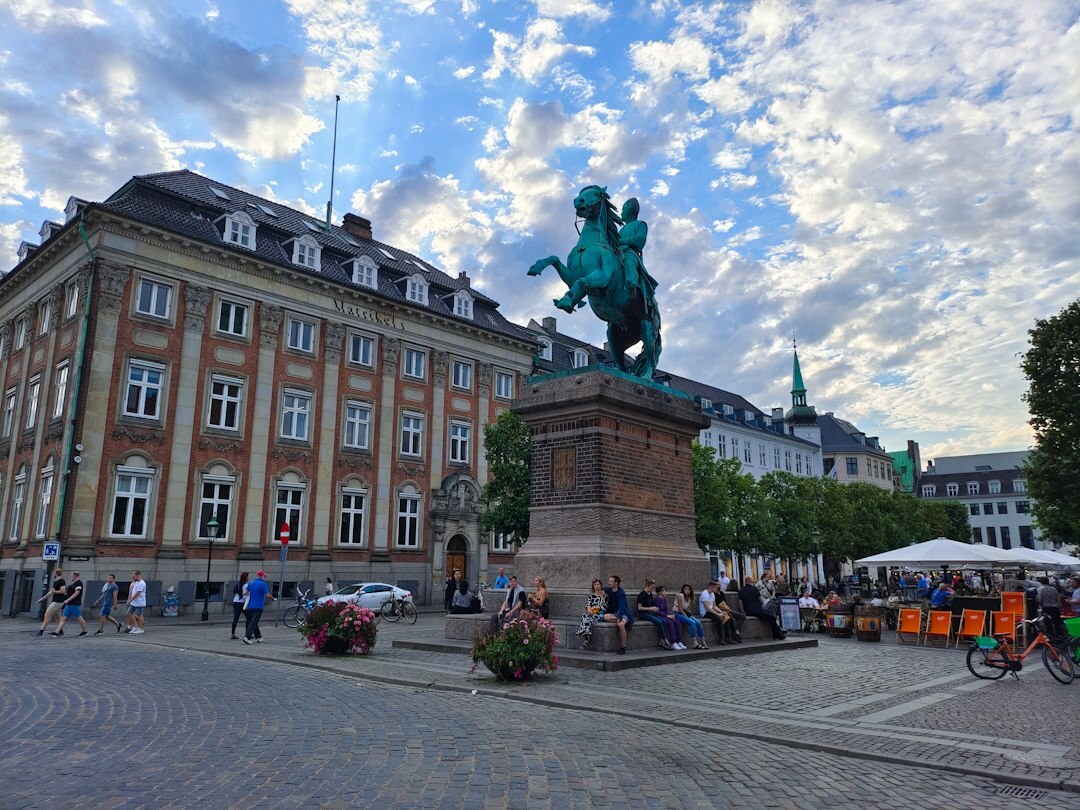 Guide leading a small group through a historic Danish neighborhood